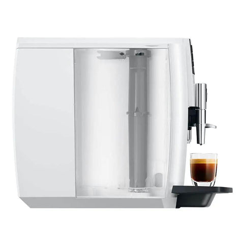 Straight Up Game Changer Automatic Espresso Coffee Maker With Easy Cappuccino Function And Premium Aroma Grinder In Sleek Piano White Finish, side view showing glass with espresso.