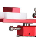 Close-up of the Kickass Watch Repair Kit Featuring Rotational Case Opener And Quick Battery Press with red metal components.