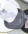 Top view of Total Game Changer Portable Mini Washing Machine With Foldaway Compact Build showing its sleek gray design and lid.