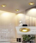 9-Pack of 3-Inch Brass LED Recessed Lights, Round Retrofit Ceiling Fixtures with Lush Gold Trim, showcasing adjustable flat baffle spotlights.