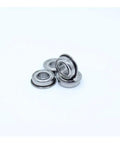 10 Pcs SF685ZZ Stainless Steel Flanged Deep Groove Ball Bearings 5x11x5 MM Double Shielded in a stack on a white background.