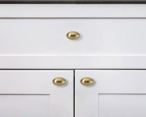 Ten Pack 1 3 Eighths Inch Champagne Bronze Cabinet Knobs Egg Shaped Satin Brass Oval Drawer Hardware Zinc Dresser Pulls For Kitchen Cabinets And Dressers With Durable Zinc Alloy Construction And Sleek Satin Finish, shown on white cabinet doors