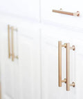 Brushed gold cabinet hardware on white doors, not the Freestone Appliance Pull From The Urban Modern Collection, 12 Inch Center To Center, Polished Chrome Finish, Snazzy Yet Durable Cabinet Hardware For Kitchen And Bath, Through Bolted Mount, Easy Install, Model 87001.