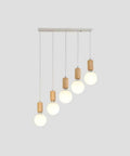 Top Shelf Three Head Disc Pendant Ceiling Light With Milky Frosted Glass Lampshades And Heavy Duty Wrought Iron Frame hanging with 5 round bulbs.