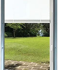 No Fuss Heavy Hitter 22 By 36 Commercial Steel Frame Door Glass Insert Featuring Buttery Smooth Raise Lower Tilt Mechanism And Built In White Mini Blinds with a view of a lawn.