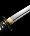 Close-up of the blade and grip of the 1095 Steel Japanese Odachi Long Sword With Iron Tsuba, Full Tang, Badass Battle Ready Sharp Edge.