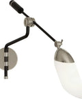 Level Up Your Interior Game With This Sick One Light Swing Arm Wall Sconce Decked Out In Matte Black And Modern Brass Details Paired With A Bright White Glass Shade For Smooth Lighting Vibes Anywhere, showing matte black and brass sconce with white glass shade.