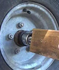 Installing Trailer Hub Cap Protector In Stainless Steel Bearing Buddies, 1.98 Inch Diameter, keeps water and dirt out of trailer hubs.