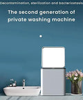 Mini Portable Washing Machine Automatic Compact Laundry Washer Quiet Foldable Frame lightweight design next to a sink with flowers.