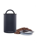 Stainless Steel Coffee Canister With Patented Inner Plunger Lid That Forces Out Oxygen And Locks In Freshness, Matte Black, with coffee beans