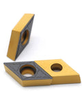 CNC Carbide Inserts Pro Grade DCMT 32.51 And DCMT 11T304 PM, showing gold and black inserts with circular holes and chip breaker edges.
