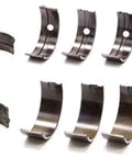 Badass Heavy Duty Main Bearing Set For Toyota 4Age And 4AgZe 1.6L Engines, steel backed bearings arranged in rows.