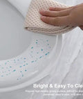 Solid Build Soft Close Elongated White Toilet Seat With Quick Release Hinges For No Sweat Installation Scratch Resistant Cover Built For Easy Cleanup And Chill Bathroom Routine being wiped clean.