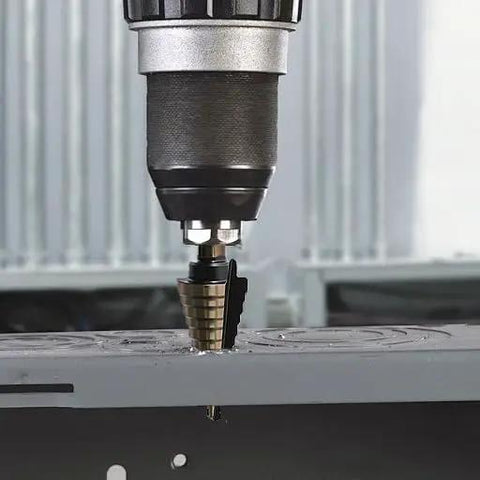 Step Drill Bit Set 5 Piece With Fifty Sizes HSS Titanium Coated Step Bits drilling into metal surface in industrial setting