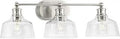 Three Light Vanity Light In Brushed Nickel For Farmhouse Style Bathrooms with clear glass shades and vintage nickel finish.
