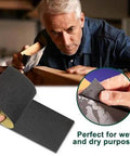 Person using 24 Piece Sandpaper Set With 12 Grits From 120 To 3000 Wet Dry Silicon Carbide Sheets for furniture smoothing