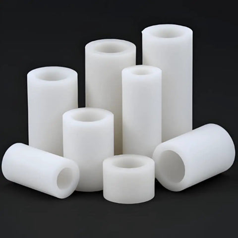 Ten Piece White Nylon Spacer Bracket Kit With Non Conductive PA66 Gaskets, 16mm And 18mm Outer Diameters, 10mm And 12mm Inner Diameters, 2mm Length, The Go To Spacer Set For Electrical, Automotive, And DIY Projects. White nylon spacer set with hollow cylindrical pieces on black background.
