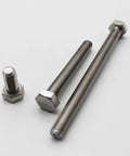 Top Shelf Grade Two Pure Titanium Hex Socket Cap Screws Built Tough With Slick Finish Heavy Duty Mechanical Fasteners For Custom Rides and Workshop Upgrades, three screws of different lengths.