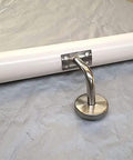 Close-up of Sleek White Wooden Stair Banister Kit Wall Mounted Handrail showing metal bracket for installation support.