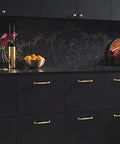 Top Knobs Grace Collection Barrow Pull 7-9/16 Inch Honey Bronze Cabinet Hardware on black kitchen drawers