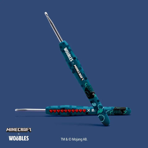 Blue Minecraft-themed crochet hooks from the Minecraft Crochet Kit For Adults And Beginners, Easy Starter Project With Prestarted Yarn.