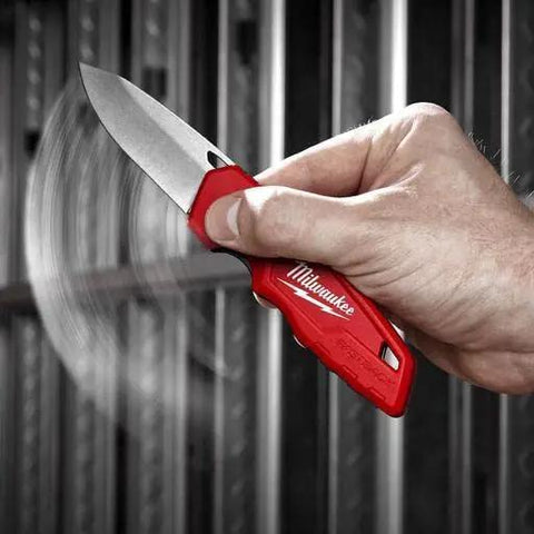 Kick Ass Red Smooth Folding Pocket Knife With Razor Sharp Steel Blade And No Sweat Snap Back Action For Tough Construction Sites And Hard Core Everyday Carry Users Who Want Hella Precision And Rock Solid Reliability Every Damn Time in hand, showcasing the smooth blade.