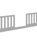Toddler Safety Guardrail Kit With Slats To Transform Crib Into Toddler Bed Pebble Gray slat-style side panels for nursery use.