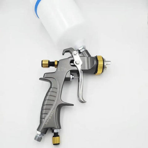 Heavy Duty Eco Friendly Pneumatic Spray Gun With Top Loading Cup shows nozzle and handle, designed for automotive painting.