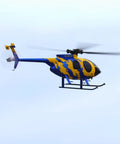 Yellow and blue MD500 Style RC Helicopter for Adults, Easy as It Gets 2.4GHz Remote, Flybarless 6-Axis Gyro in flight
