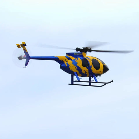 Yellow and blue MD500 Style RC Helicopter for Adults, Easy as It Gets 2.4GHz Remote, Flybarless 6-Axis Gyro in flight