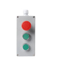 NVVVNX metal push-button control box front view with red emergency stop and two green buttons on a silver panel