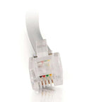 Close-up of RJ11 Modem Cable For Landline Phones And DSL Modems No Frills 7 Foot Silver Telephone Cable With RJ11 Male Connectors On Both Ends