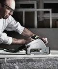 Pro Shop Ready Track Saw Delivering Heavy Duty Performance With 1200 Watt Motor And Hella Precise Negative One To Forty Seven Degree Bevel Cuts Plus Smooth Operation Guide Rail System used by a tradesman on a work table.