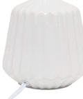 Close-up of pleated white ceramic base of Petite Pleated Ceramic Table Lamp With Off White Fabric Shade 5 Ft Cord 40W Type B Bulb