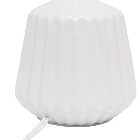 Close-up of pleated white ceramic base of Petite Pleated Ceramic Table Lamp With Off White Fabric Shade 5 Ft Cord 40W Type B Bulb