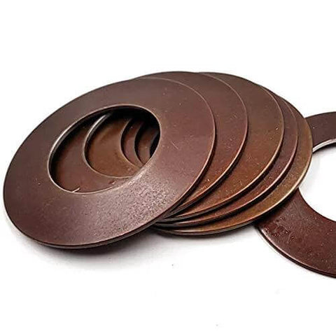 Waterjet cutting head disc springs, brown metal washers with central holes.