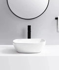 Bathroom Sink Bathroom Vessel Sink Household Ceramic Wash Basin Hotel Countertop Basin Ceramic Vessel Sink Square Art Basin Bathroom Sink Vessel installed on white countertop with round mirror.