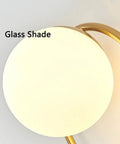 Close-up of Modern Luxury Sphel Glass lampshade Wall Sconce 9.0 Inch Width den Iron Body Wall Lamp with 3 Color Mode Indoor Lighting Fixture.