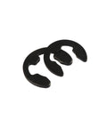 Close-up of two E clips from the Must Have 580 Piece External Retaining Ring E Clip Circlip And Washer Kit In Black Carbon Steel.