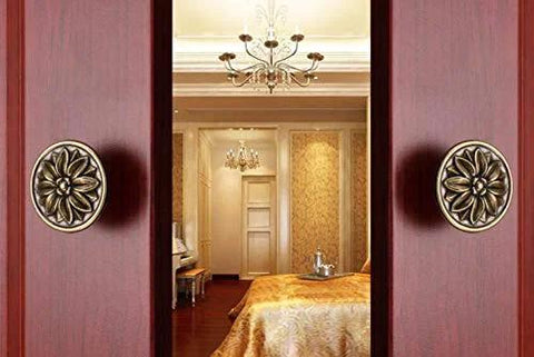 Close-up of 6 Piece Set Vintage Flower Drawer Pulls Knobs With Floral Embossing In Black Finish on wooden cabinet doors