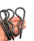 Close-up of black Heavy Duty Hitch Pin Set R Clip Hair Pins 10 Pack M4x90 Steel Cotter Pin Assortment in hand