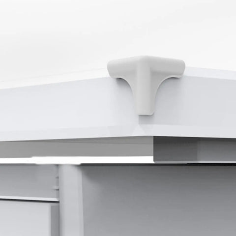 Silicone corner guard attached to table, 8 Pack Silicone Corner Guards for Kitchen Tables and Furniture Edges, safety protector in use.