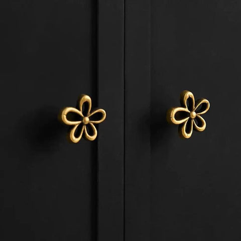 Bougie Antique Brass Flower Cabinet Knobs Vintage Aesthetic Boho Decor Hardware Set of 4 on black cabinet doors.