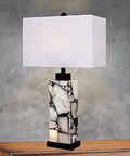Table Lamp With Black And Cream Finish, Designer Linen Shade, And Easy To Use 3 Way Switch on a wooden table in a living room
