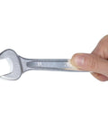 Hand holding a wrench from the 42 Series 17-Piece Metric Wrench Set With 12-Point Box Ends and 15 Degree Offset Open and Box Ends, Sturdy Alloy Steel, Italian Made.