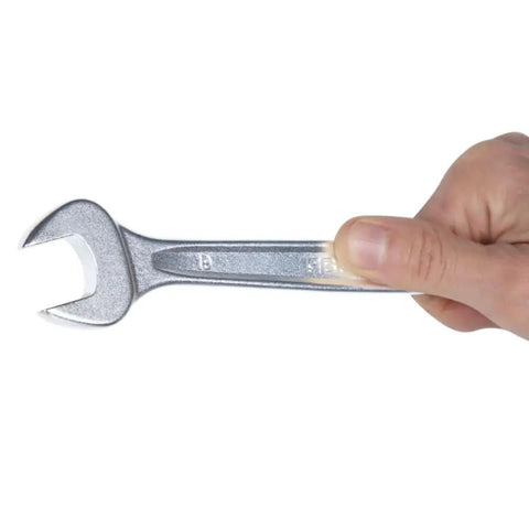 Hand holding a wrench from the 42 Series 17-Piece Metric Wrench Set With 12-Point Box Ends and 15 Degree Offset Open and Box Ends, Sturdy Alloy Steel, Italian Made.