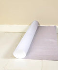 Slick And Tough Foam Underlayment Roll For Laminate And Wood Flooring With Moisture Resistant Barrier on white floor.