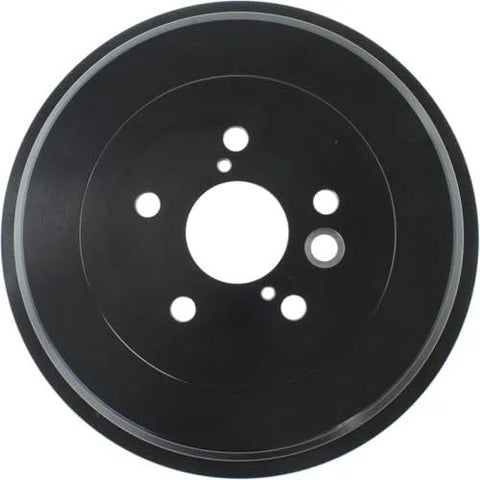 Front view of rear brake drum, black metal with bolt holes.