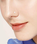 Close-up view of a nose with clear bioflex piercing retainer, part of the 38 Piece Clear Piercing Retainer Set Bioflex Jewelry For Nose Rings