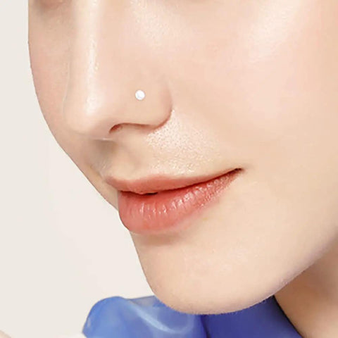 Close-up view of a nose with clear bioflex piercing retainer, part of the 38 Piece Clear Piercing Retainer Set Bioflex Jewelry For Nose Rings